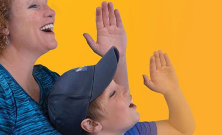Mother and son voicing opinion with cupped hand